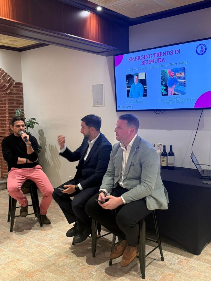 Speakers on stage at Gosling's Wine Cellar